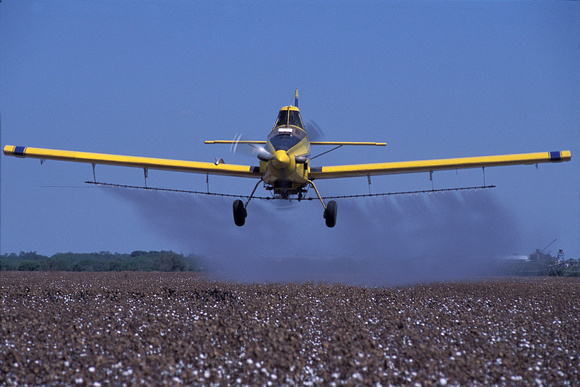 Aerial spraying of cotton by L&W flight service in Uvalde TX  Georgic Odyssey project - Photograph by Edwin Remsberg